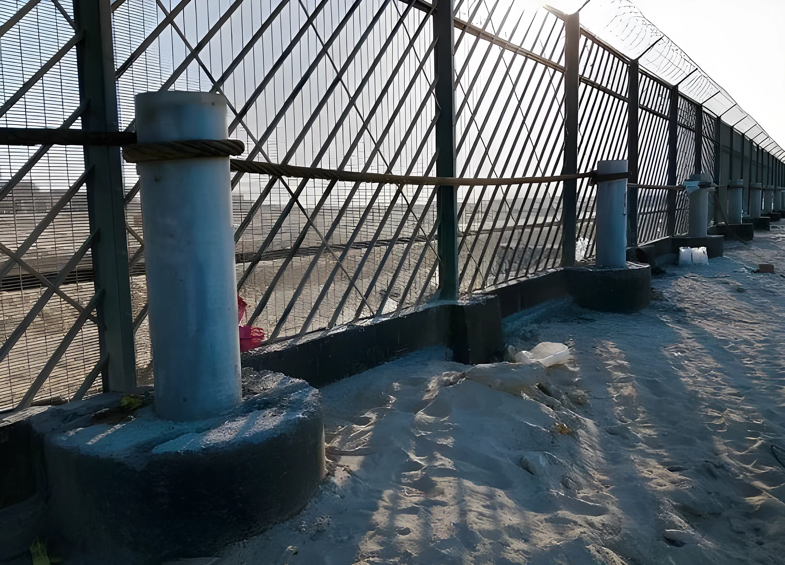Security fence on cast post footings